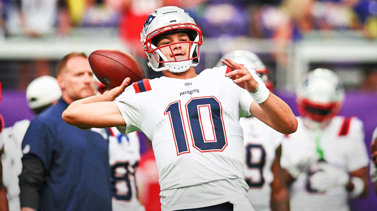 New England Patriots quarterback Drake Maye (10) warms up before the game against the Minnesota Vikings at U.S. Bank Stadium.
