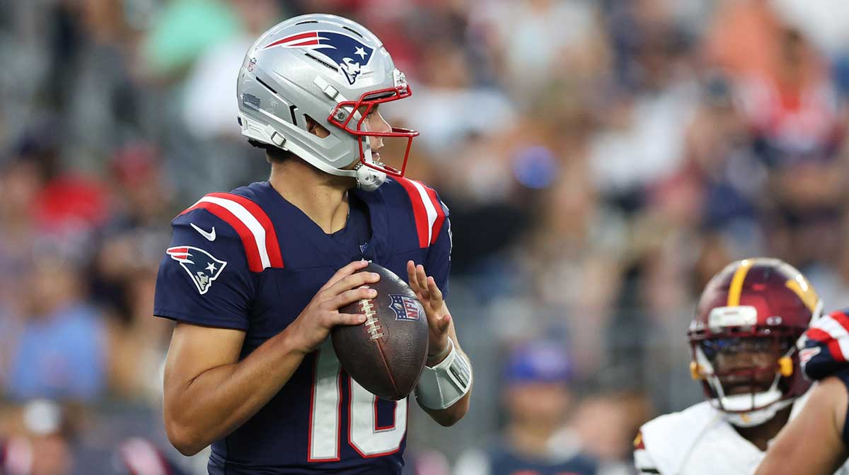 New England Patriots quarterback Drake Maye (10) looks to pass during the first half against the Washington Commanders at Gillette Stadium.
