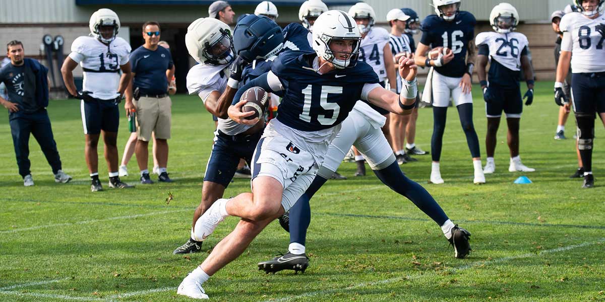 Penn State quarterback Drew Allar (15) runs with the ball during practice outside Holuba Hall on Saturday, August 2, 2025, in State College.