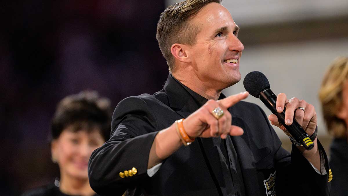 New Orleans Saints retired quarterback Drew Brees (9) reacts during his hall of fame ceremony at halftime against the Denver Broncos