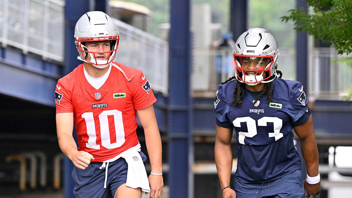 New England Patriots quarterback Drake Maye (10) and safety Kyle Dugger (23) walk to the practice fields at Gillette Stadium.