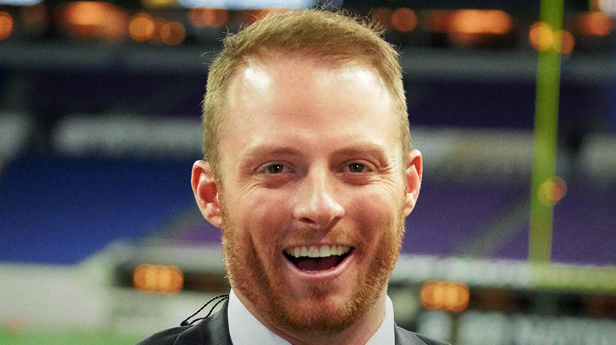 Greg McElroy attends the 2022 CFP college football national championship game at Lucas Oil Stadium.