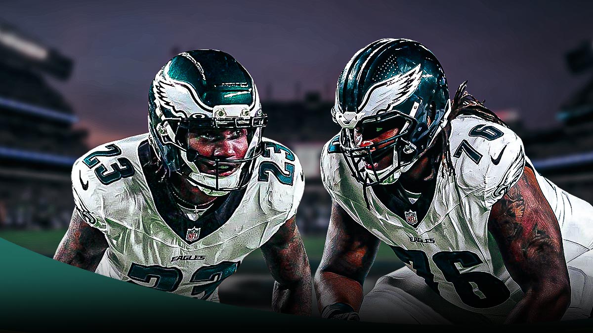 Kenyon Green and Eli Ricks in their Eagles uniform in front of the stadium.