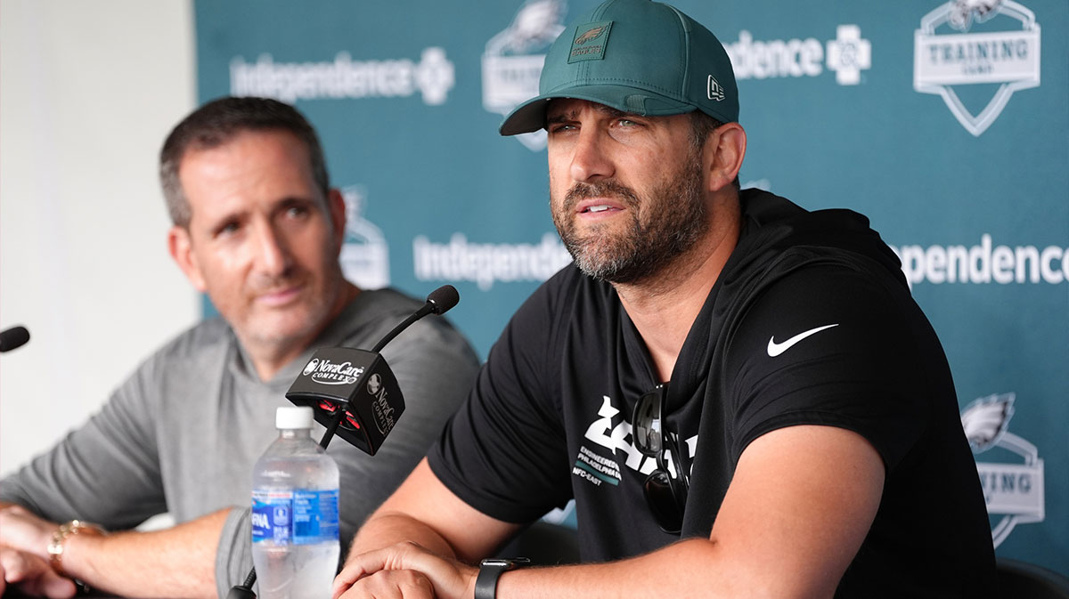 Eagles head coach Nick Sirianni addresses media during training camp at NovaCare Complex. Mandatory Credit: Kyle Ross-Imagn Images with the Eagles' John Metchie III and DeVonta Smith in the background