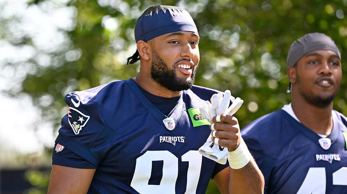 New England Patriots edge Elijah Ponder (91) walks to the practice field for training camp at Gillette Stadium