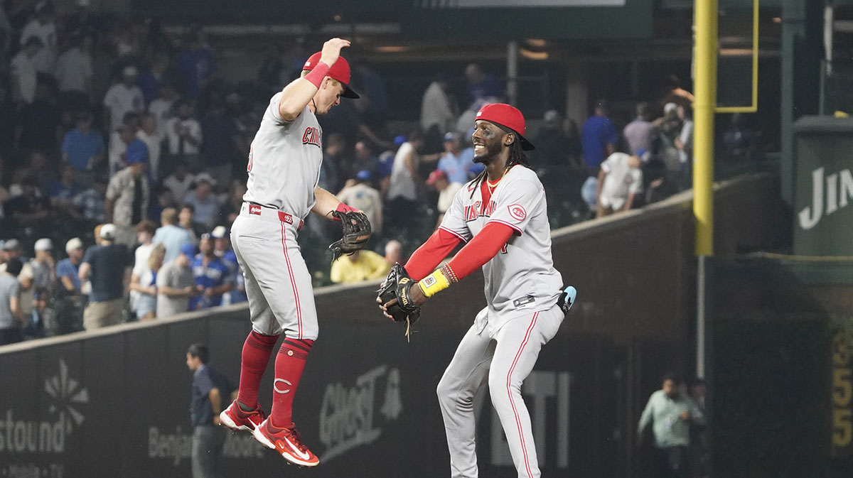Cincinnati Reds shortstop Elly De La Cruz (44) and second base Matt McLain (9) celebrate their win against the Chicago Cubs at Wrigley Field.