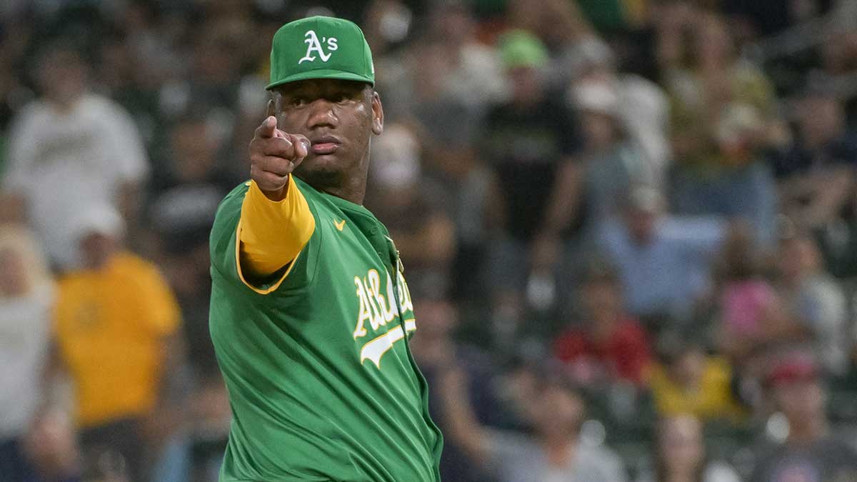 Athletics pitcher Elvis Alvarado (61) points to the third base umpire during the ninth inning of the game against the Detroit Tigers at Sutter Health Park.