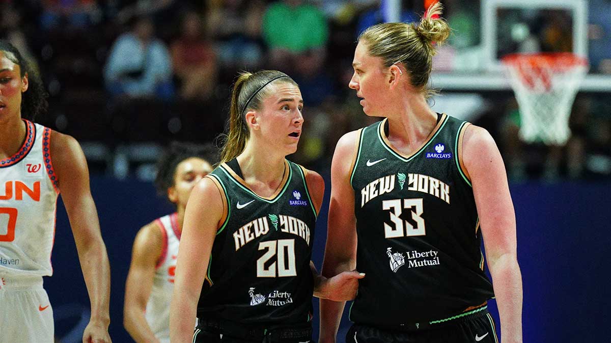 New York Liberty guard Sabrina Ionescu (20) talks with forward Emma Meesseman (33) as they take on the Connecticut Sun in the first half at Mohegan Sun Arena. 