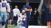 Dallas Cowboys quarterback Dak Prescott (4) and offensive coordinator Brian Schottenheimer watch a play in the game against the Jacksonville Jaguars at AT&T Stadium.