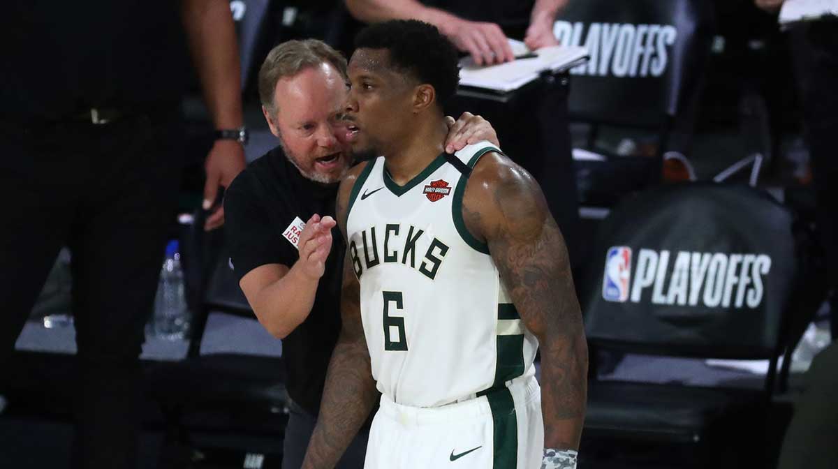 Milwaukee Bucks head coach Mike Budenholzer talks with guard Eric Bledsoe (6) during the second half of game five in the second round of the 2020 NBA Playoffs against the Miami Heat at ESPN Wide World of Sports Complex.