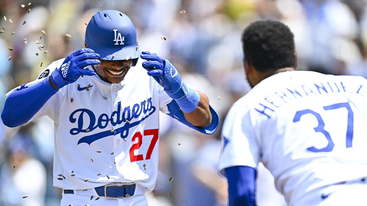 Los Angeles Dodgers outfielder Esteury Ruiz (27) celebrates with outfielder Teoscar Hernandez (37) after hitting a one run home run against the Milwaukee Brewers during the fifth inning at Dodger Stadium.