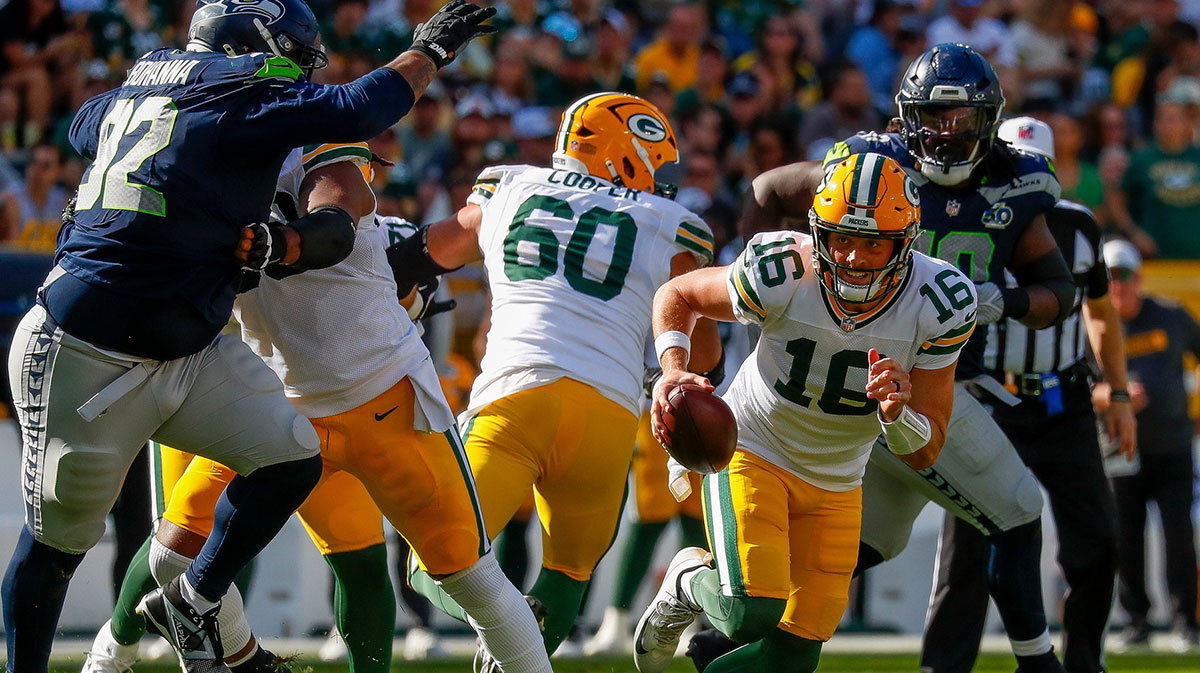 Green Bay Packers quarterback Sean Clifford (16) scrambles out of the pocket against the Seattle Seahawks during their final preseason game on Saturday, August 23, 2025, at Lambeau Field in Green Bay, Wis.