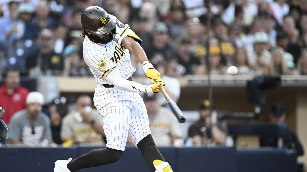 Jul 10, 2025; San Diego, California, USA; San Diego Padres right fielder Fernando Tatis Jr. (23) hits a solo home run during the third inning against the Arizona Diamondbacks at Petco Park. 