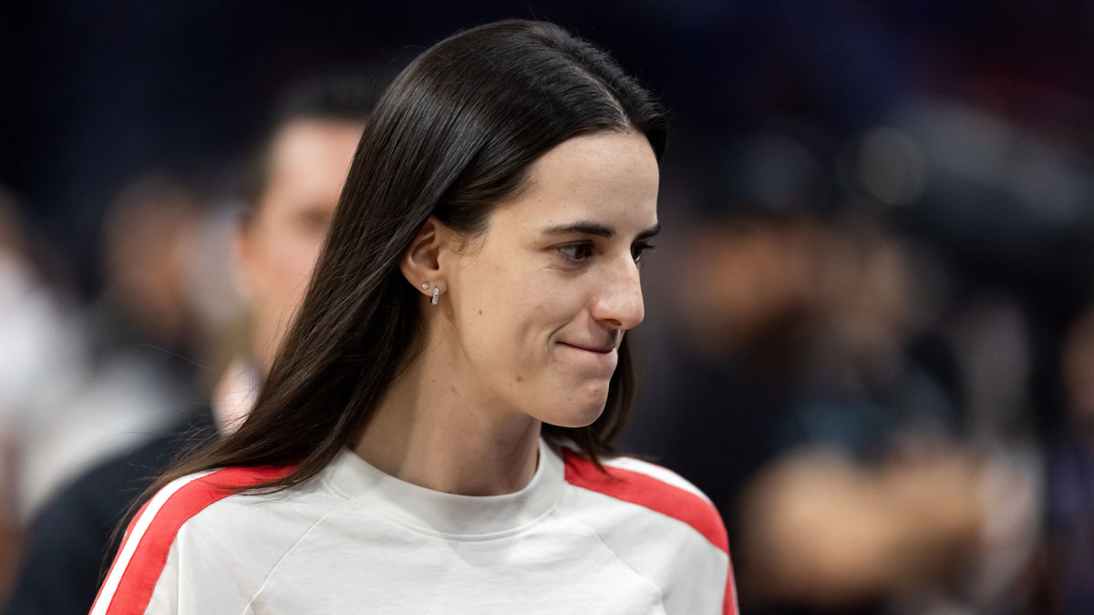 Fever injured guard Caitlin Clark in attendance against the Phoenix Mercury during an WNBA game at PHX Arena with Jeff Teague and Nancy Lieberman in the background
