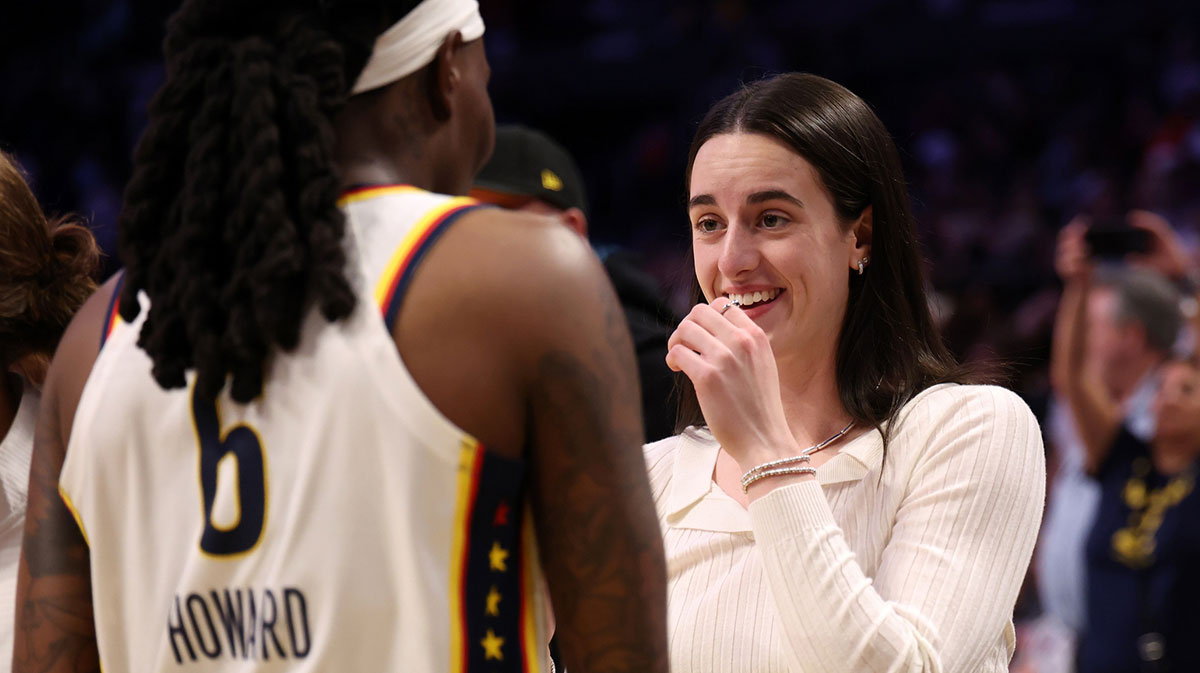 Fever guard Caitlin Clark (22, right) celebrates