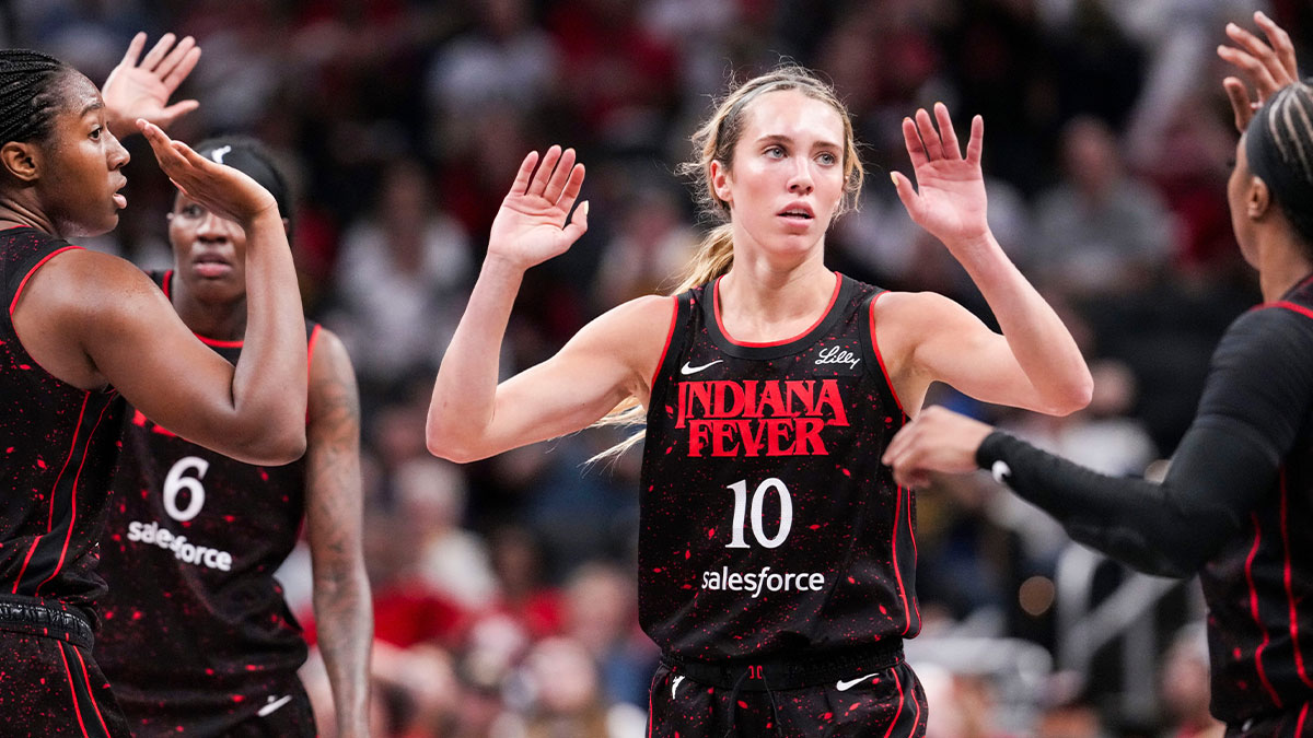 Fever guard Lexie Hull (10) high-fives her teammates Tuesday, Aug. 26, 2025, during a game between the Indiana Fever and the Seattle Storm at Gainbridge Fieldhouse in Indianapolis. The Indiana Fever defeated the Seattle Storm, 95-75.