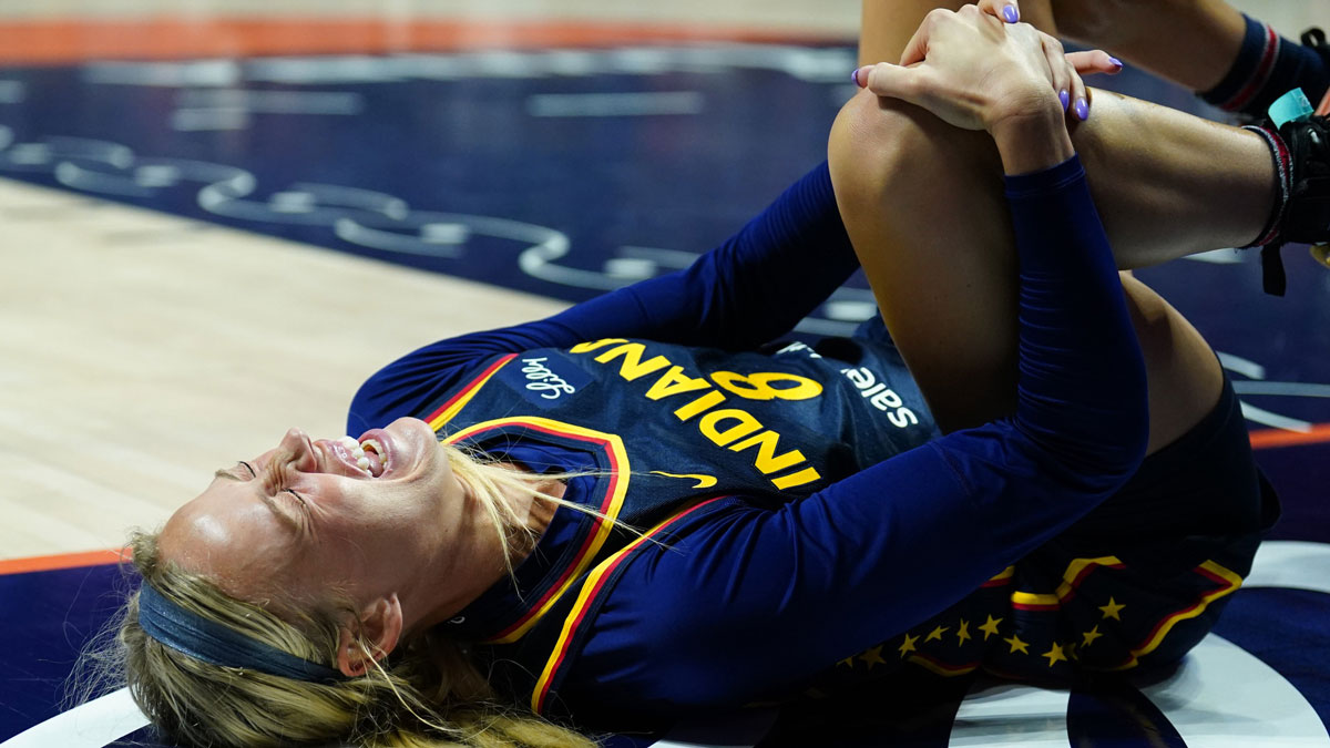 Indiana Fever guard Sophie Cunningham (8) on the court injured as they take on the Connecticut Sun in the first half at Mohegan Sun Arena. Sophie Cunningham injury sparks outrage as her sister blasts WNBA and refs, highlighting ongoing injury concerns and officiating issues.