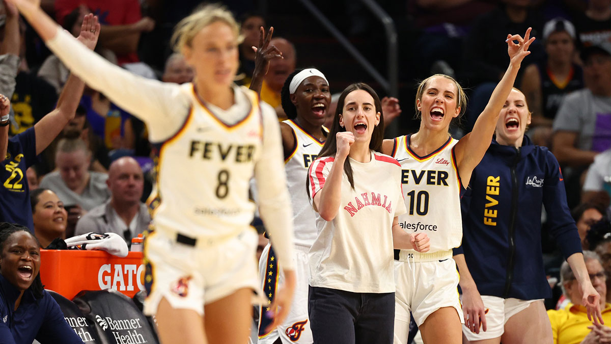 Indiana Fever guard Caitlin Clark (center) and guard Lexie Hull (10) celebrate the three pointer by Sophie Cunningham (8) against the Phoenix Mercury in the first half of a WNBA game at PHX Arena.