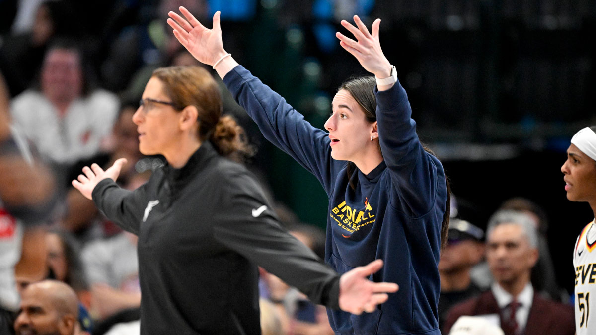 Indiana Fever head coach Stephanie White and guard Caitlin Clark (22) react to a call during the first half against the Dallas Wings at the American Airlines Center.