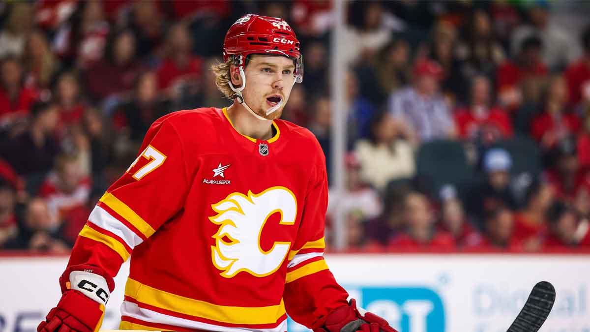 Calgary Flames center Connor Zary (47) skates against the Vancouver Canucks during the first period at Scotiabank Saddledome.
