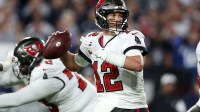 Tampa Bay Buccaneers quarterback Tom Brady (12) drops back to pass against the Dallas Cowboys in the second half during the wild card game at Raymond James Stadium.