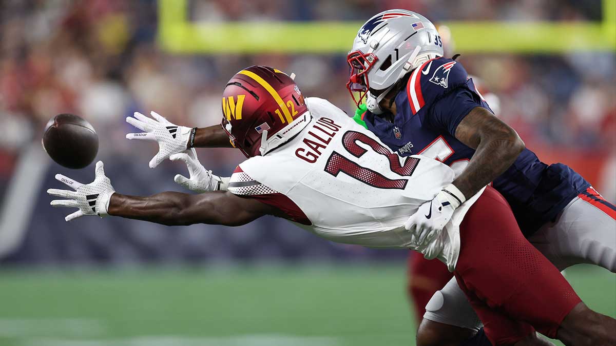 New England Patriots cornerback Miles Battle (35) breaks up a pass to Washington Commanders receiver Michael Gallup (12) during the first half at Gillette Stadium.