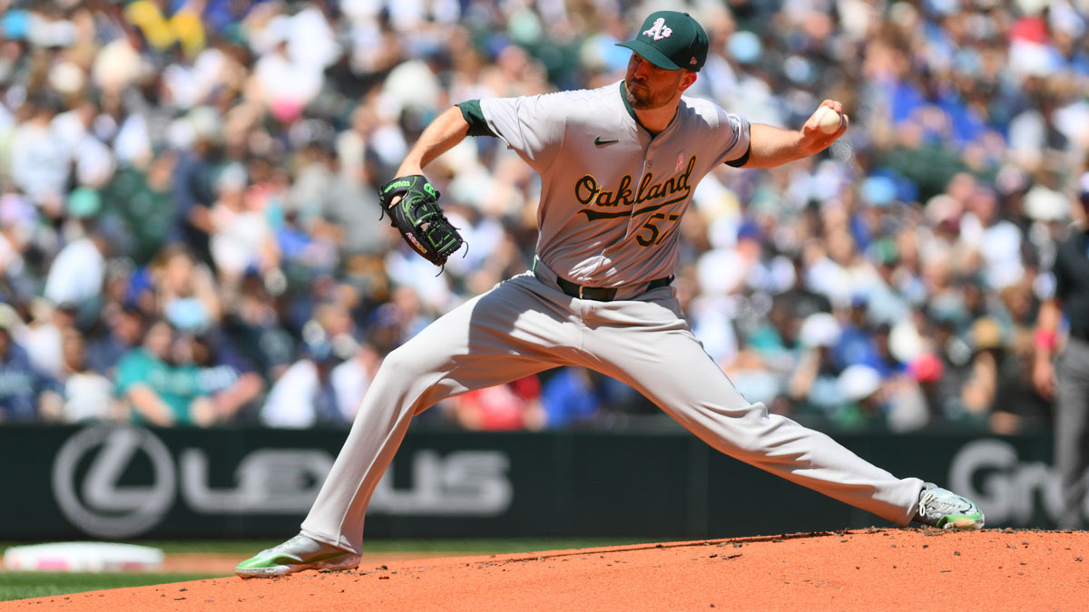 Athletics starting pitcher Alex Wood (57) pitches to the Seattle Mariners during the first inning at T-Mobile Park