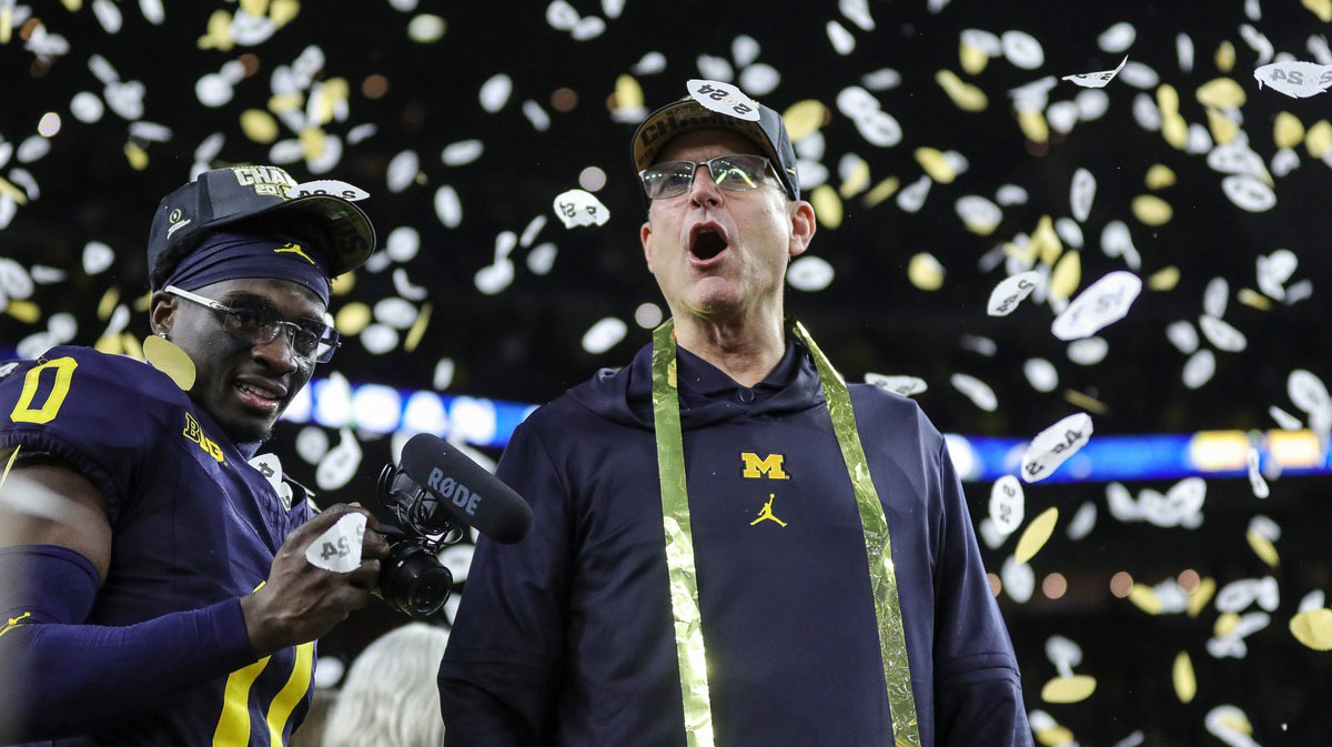 Michigan head coach Jim Harbaugh celebrates during the trophy presentation after the 34-13 win over Washington at the national championship game at NRG Stadium in Houston on Monday, Jan. 8, 2024.