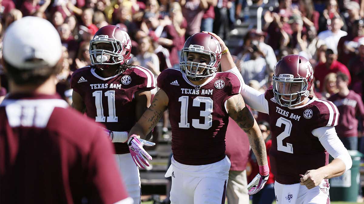 Texas A&M Aggies wide receiver Mike Evans (13) celebrates with quarterback Johnny Manziel (2) after scoring a touchdown against the Auburn Tigers during the first half at Kyle Field.