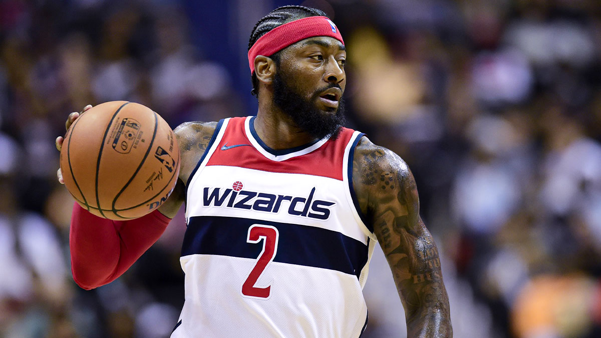 Washington Wizards guard John Wall (2) dribbles up the court during the third quarter against the Miami Heat at Capital One Arena.