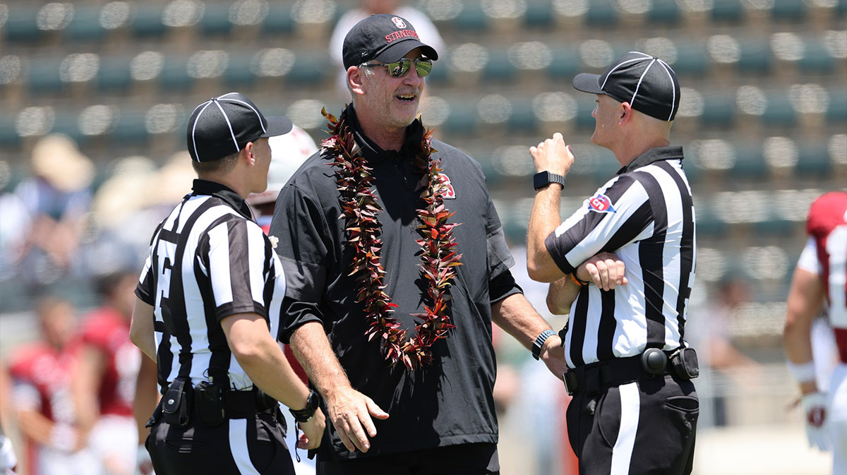 Stanford Cardinal head coach Frank Reich speaks to officials before an NCAA college football game against the Hawaii Rainbow Warriors at Clarence T.C. Ching Athletics Complex.
