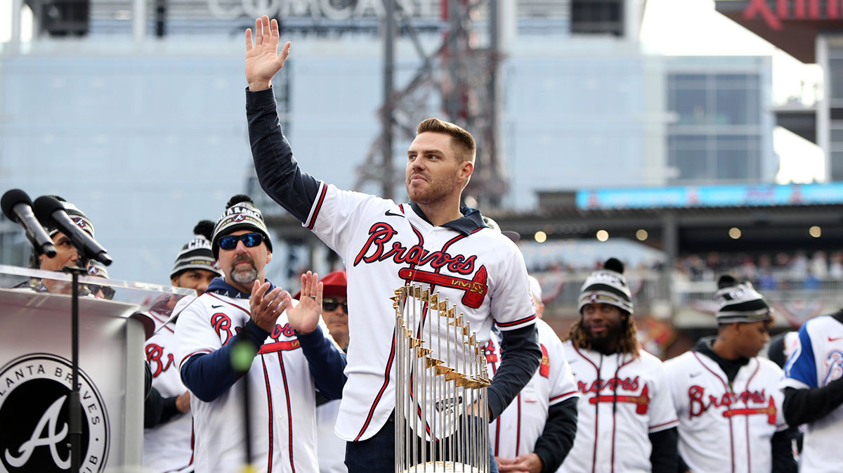 Atlanta Braves first baseman Freddie Freeman waves to the crowd during the World Series championship rally at Truist Park.