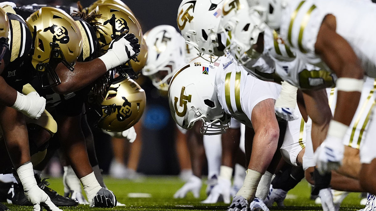 Members of the Colorado Buffaloes line across from the Georgia Tech Yellow Jackets during the fourth quarter at Folsom Field.
