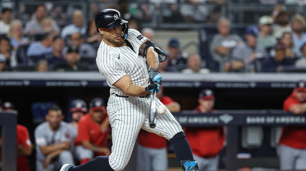 New York Yankees right fielder Giancarlo Stanton (27) hits a three run double in the third inning against the Washington Nationals at Yankee Stadium.