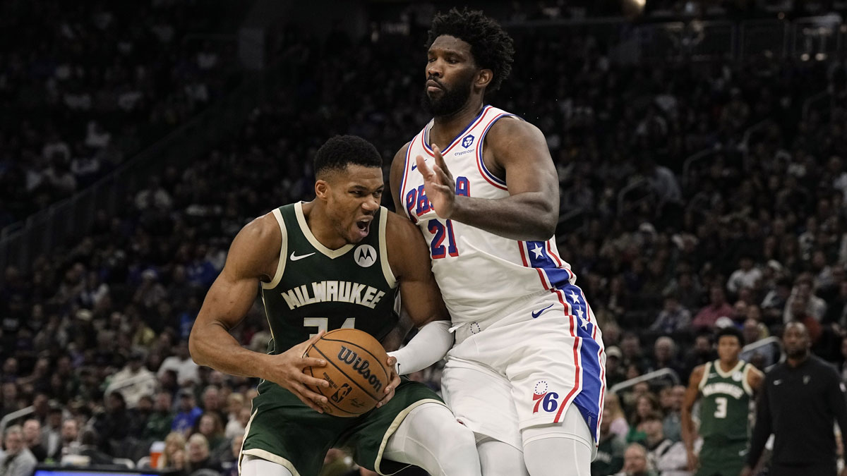 Milwaukee Bucks forward Giannis Antetokounmpo (34) looks to shoot agasint Philadelphia 76ers center Joel Embiid (21) during the second quarter at Fiserv Forum.