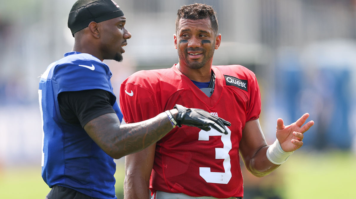 New York Giants wide receiver Malik Nabers (1) talks with quarterback Russell Wilson (3) during training camp at Quest Diagnostics Training Center.