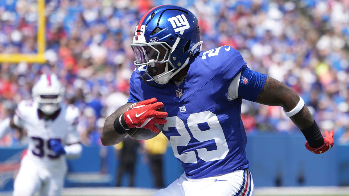 New York Giants running back Tyrone Tracy Jr. (29) runs with the ball against the Buffalo Bills during the first half at Highmark Stadium.