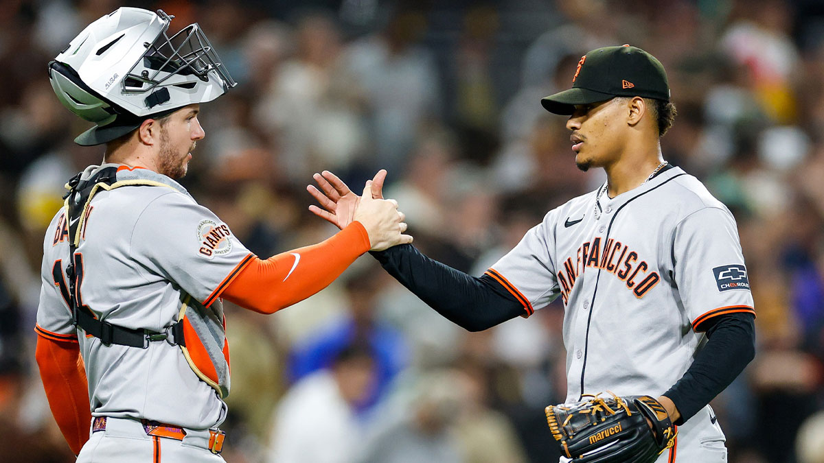San Francisco Giants catcher Patrick Bailey (14) celebrates with relief pitcher Randy Rodriguez (73) after defeating the San Diego Padres at Petco Park.
