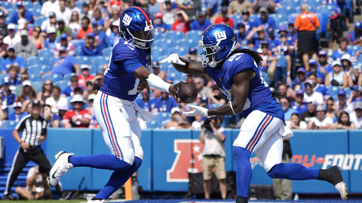 New York Giants quarterback Jameis Winston (19) hands off the ball to New York Giants running back Devin Singletary (26) during the second half at Highmark Stadium.