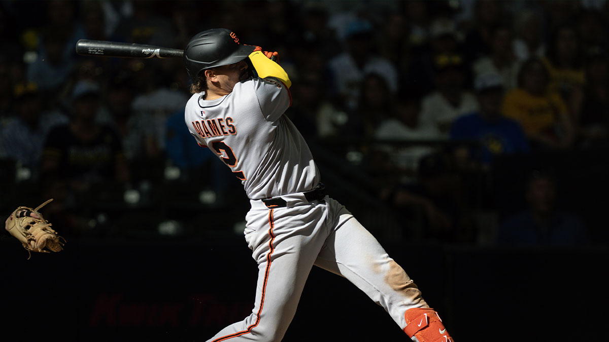 San Francisco Giants shortstop Willy Adames (2) singles during the eighth inning against the Milwaukee Brewers at American Family Field.