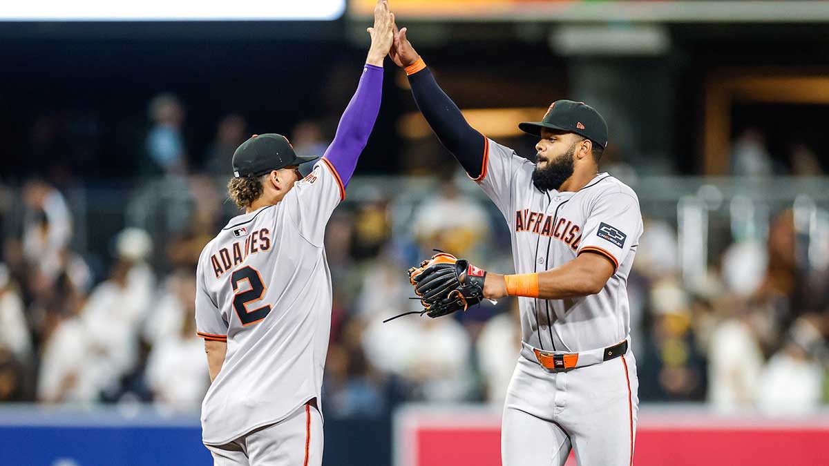 San Francisco Giants shortstop Willy Adames (2) celebrates with left fielder Heliot Ramos (17) after defeating the San Diego Padres at Petco Park.