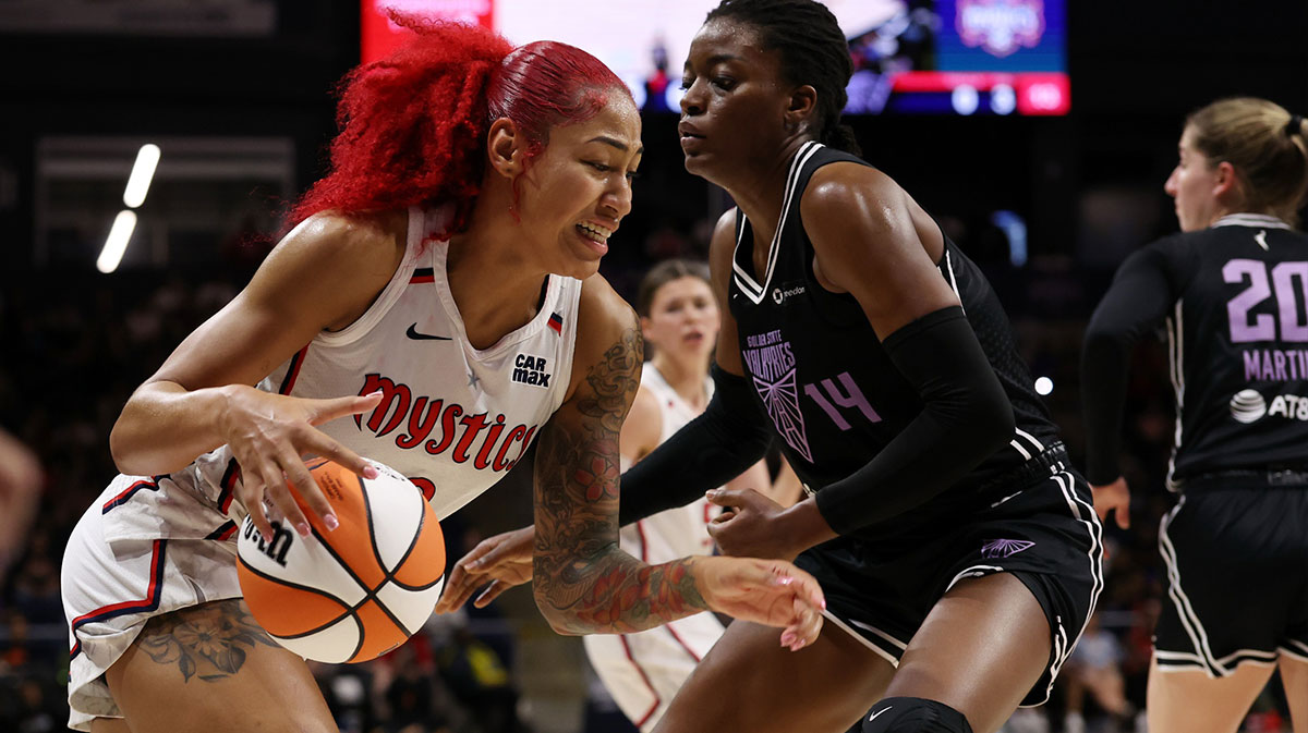 Washington Mystics forward Shakira Austin (0) drives to the basket as Golden State Valkyries center Temi Fagbenle (14) defends in the second half at CareFirst Arena.