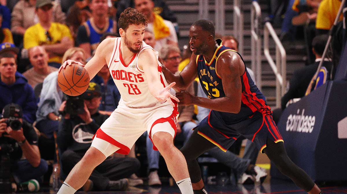 Houston Rockets center Alperen Sengun (28) controls the ball against Golden State Warriors forward Draymond Green (23) during the second quarter of game four of the 2025 NBA Playoffs first round at Chase Center.