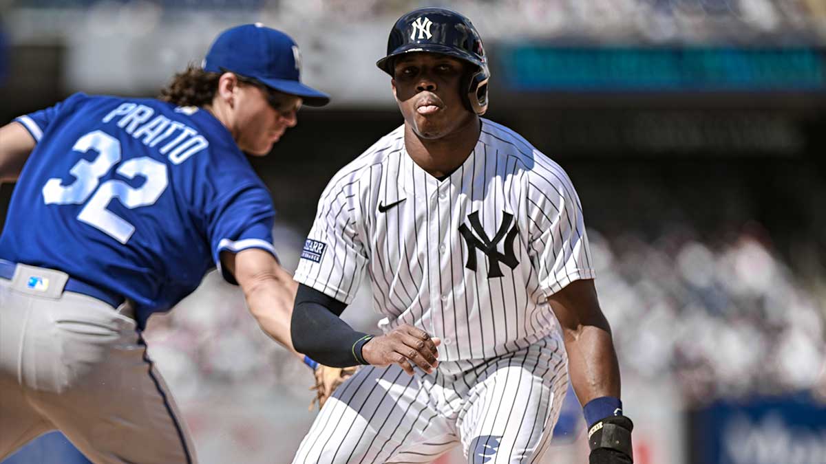 New York Yankees center fielder Greg Allen (30) retreats safely back to first base after a pick off attempt by Kansas City Royals relief pitcher Taylor Clarke (45) during the seventh inning at Yankee Stadium.