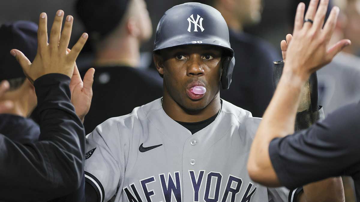 New York Yankees center fielder Greg Allen (30) celebrates after scoring against the Miami Marlins during the ninth inning at loanDepot Park.