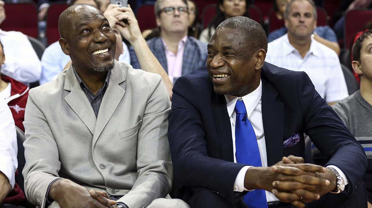 Former Houston Rockets players Hakeem Olajuwon (left) and Dikembe Mutombo (right) laugh during the game against the Sacramento Kings at Toyota Center.