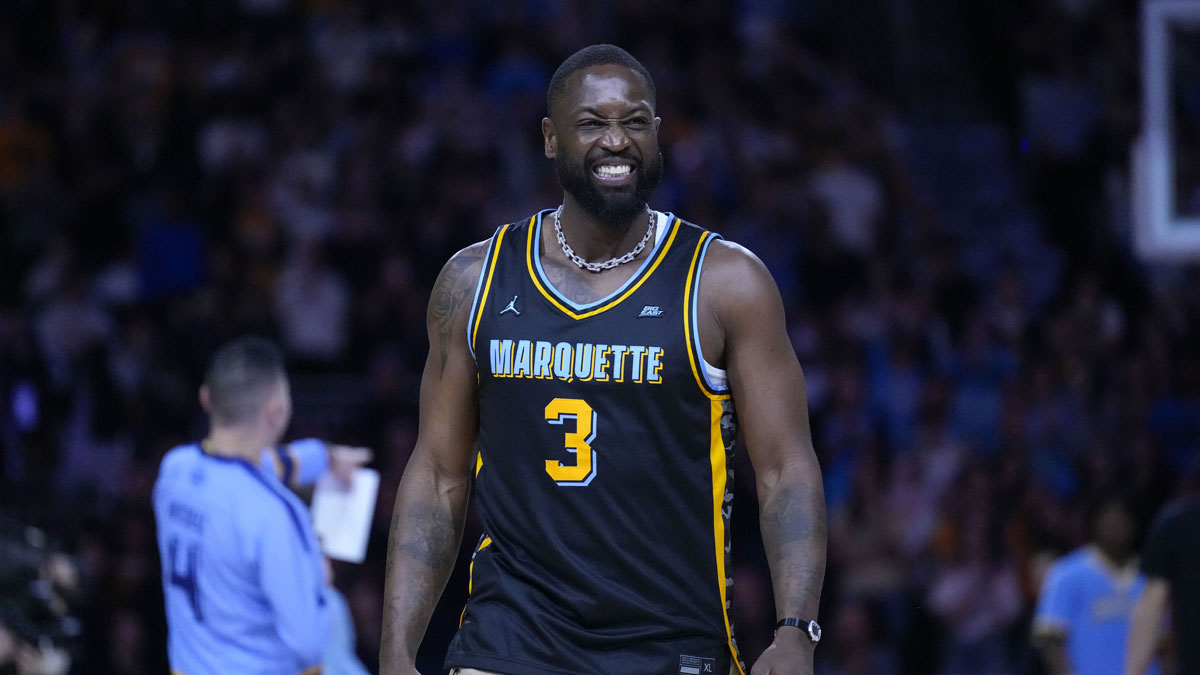 Dwyane Wade smiles timeout during the first half of the game against the Providence Friars at Fiserv Forum