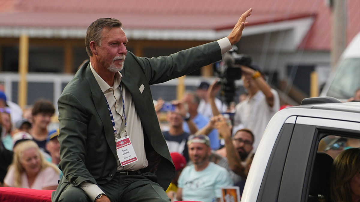 Hall of Famer Randy Johnson waves to the crowd as he arrives at the National Baseball Hall of Fame during the Parade of Legends in Cooperstown, NY..