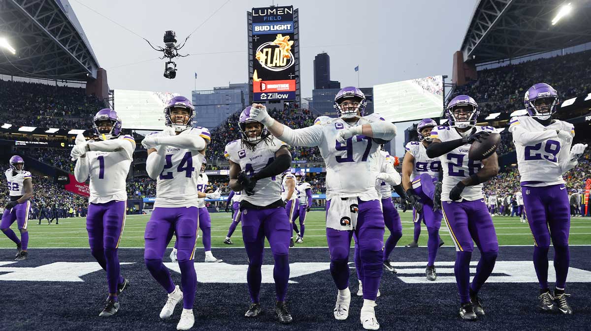 Minnesota Vikings safety Theo Jackson (26, second from right) leads a dance with cornerback Shaquill Griffin (1), safety Camryn Bynum (24), safety Josh Metellus (44), defensive tackle Harrison Phillips (97) and cornerback Dwight McGlothern (29) following his interception against the Seattle Seahawks during the fourth quarter at Lumen Field.