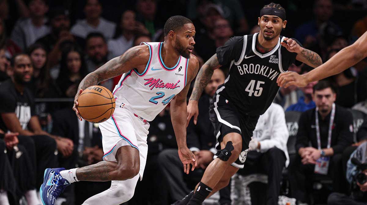 Miami Heat forward Haywood Highsmith (24) dribbles as Brooklyn Nets guard Keon Johnson (45) defends during the first quarter at Barclays Center.